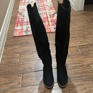 Women’s not rated brand size 8 black and cheetah boots.